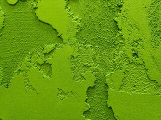 Texture of plastered wall in emerald green and light green colors