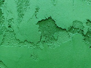 Texture of plastered wall in emerald green and light green colors