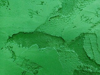 Texture of plastered wall in emerald green and light green colors