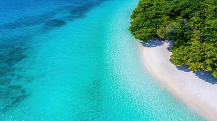 Stunning aerial view of a tropical beach with clear turquoise waters and lush greenery along the shoreline.