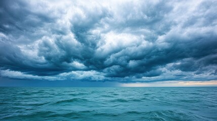Obraz premium Open ocean with choppy waves under dramatic stormy clouds. Natural seascape photography.