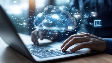 A person using a laptop with a digital cloud interface, symbolizing cloud computing.