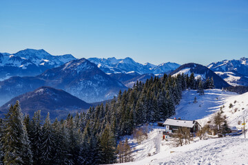 Winter mountain panorama of the Bavarian Alps and the Spitzsteinhaus (mountain inn)