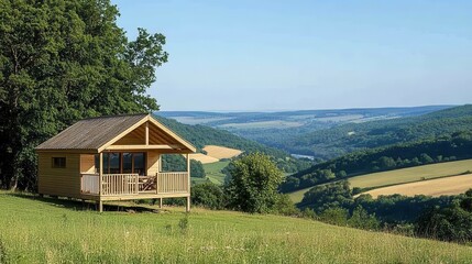 Obraz premium Wooden Cabin Overlooking Scenic Valley Landscape