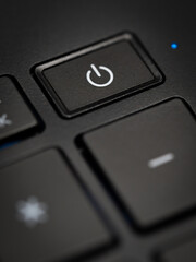 A close-up of a power button on a laptop