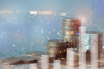 Financial investment concept, Double exposure of city night and stack of coins for finance...