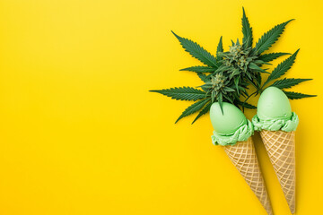 Cannabis leaf over green ice cream cone isolated on yellow background