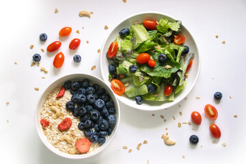Fresh Salad and Berry Oatmeal Bowl for Breakfast