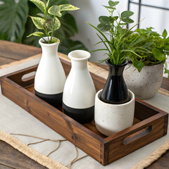 white and black ceramic vases wooden tray