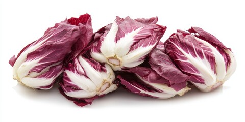 Fototapeta premium Red chicory, also known as radicchio, displayed beautifully against a white background, showcasing the unique colors and textures of red chicory, perfect for culinary presentations.