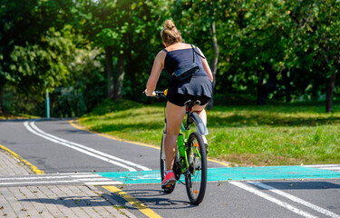 Cyclist ride on the bike path in the city Park
