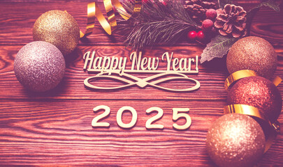 Happy new year 2025 on wooden brown background
