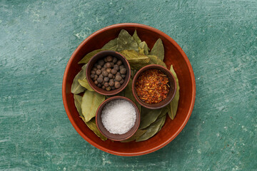 close-up of various spices in a bowl, top view