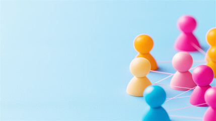 Obraz premium A colorful arrangement of game pawns in various hues on a pastel background. Symbolic of diversity, teamwork, strategy, and playful creativity.