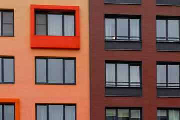 Modern residential building facade with colorful windows for architectural design concepts