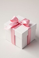 Obraz premium Delicate white gift box with a soft pink ribbon tied in a bow, texture, decorative, white