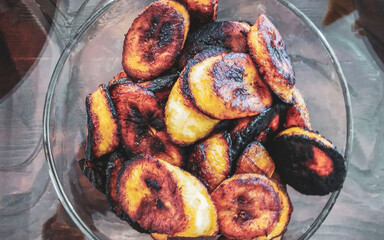 Fried plantains in the bowl in Mexico. © Arkadi