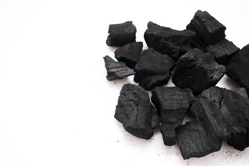 Pile of natural wood charcoal isolated on a white background. Hard wood charcoal.