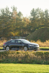 Fototapeta premium Black car on countryside highway