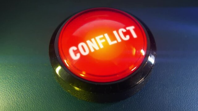 Pressing the big red button labeled with the message "Conflict"