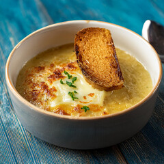 Steaming Bowl of French Onion Soup with Cheese