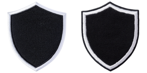 Two shield-shaped patches with black fabric, bordered by white edges, displaying a simple and bold design.