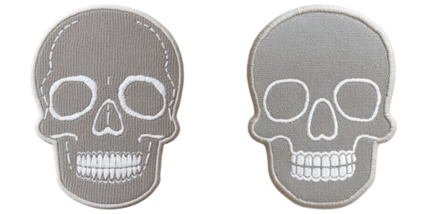 Two embroidered skull patches featuring distinct designs, showcasing details like eye sockets and teeth.