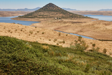 Picturesque hill pyramidal shape huge roundabout and road. Extremadura, Spain