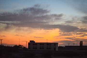 sunset over the city old building colorful sky