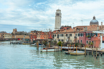Boats Docked on the Canale di San Pietro with Venetian Buildings and Basilica di San Pietro di...