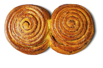 Two cinnamon buns covered with sugar on a white background