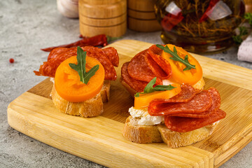 Bruschetta with sausage and tomato