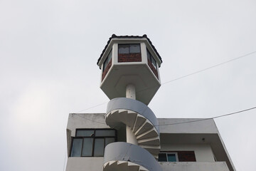 A staircase architecturally connecting upper and lower floors, creating a vertical link between spaces.