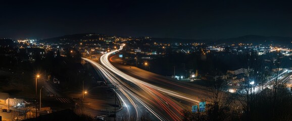 Obraz premium Night highway traffic light trails over city.
