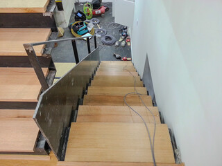 A staircase architecturally connecting upper and lower floors, creating a vertical link between spaces.