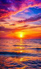 Fototapeta premium Peaceful seaside sunset with soft waves and stunning skies painted in vibrant shades, ideal for mobile wallpaper background