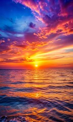 Obraz premium Majestic sunset over the ocean with radiant colors blending in the sky, offering a tranquil and picturesque seascape