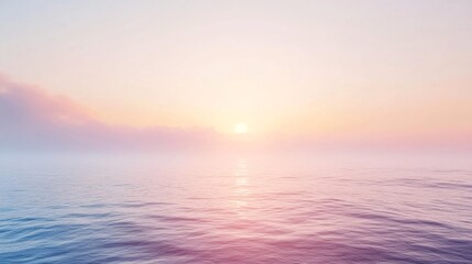 Obraz premium Pastel colors sunrise over calm ocean with soft pink and blue sky