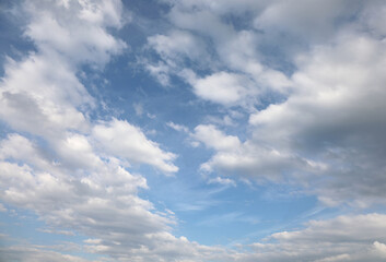 background with blue sky and white clouds ideal as a concept of purity and paradise