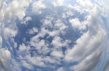 blue sky and white clouds ideal as a background for the concept of weather forecast or for purity...
