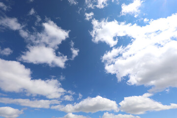 Fototapeta premium sky after the storm with white clouds and sunlight streaming through