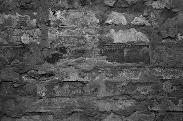 gray brick wall of an old building close up