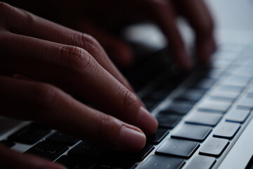 close up hand typing on keyboard