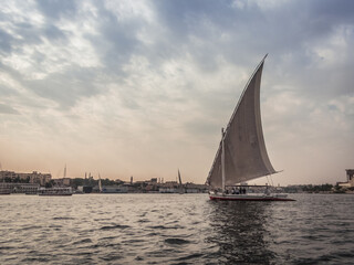 Sailboat on the Nile at Sunrise: Tranquil Morning in Egypt