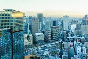 Cityscape of Osaka City in the evening from Umeda sky building tower, Osaka, Japan. Aerial view....