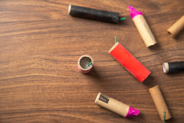 Firecrackers on the wooden background.