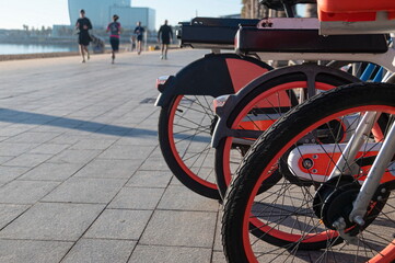 Rental municipal bicycles on a Barceloneta promenade in Barcelona, Spain.