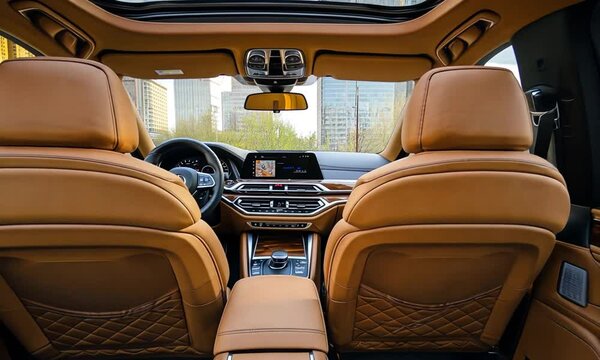 Luxurious Tan Leather Interior of a Modern SUV with Panoramic Sunroof