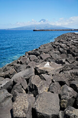View of the Pico volcano from the harbor on the Azores island of Fial