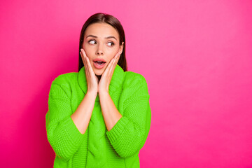 Portrait of astonished girl looking screaming touching her face wearing knitted sweater isolated...